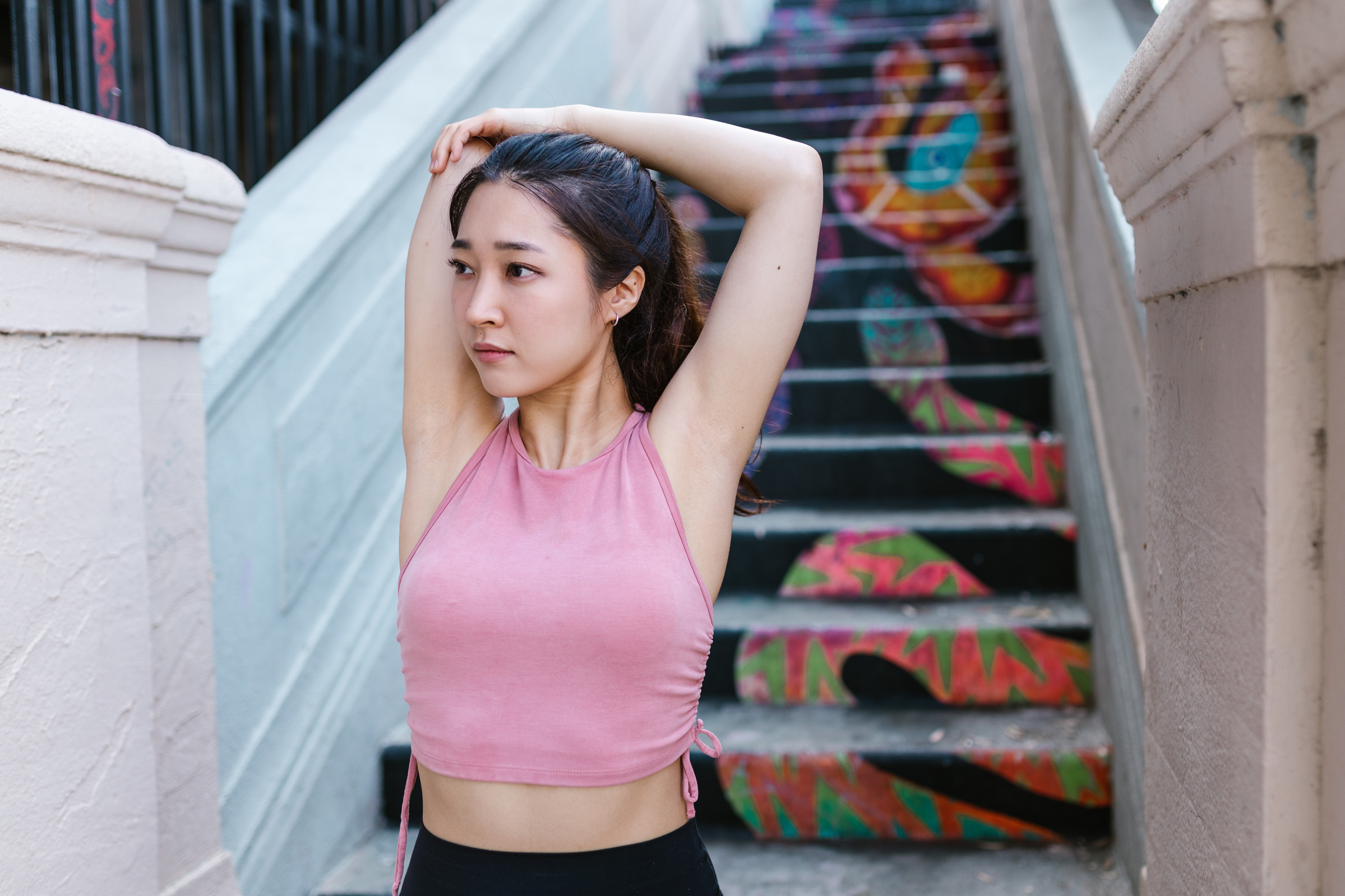 A Woman in Pink Tank Exercising